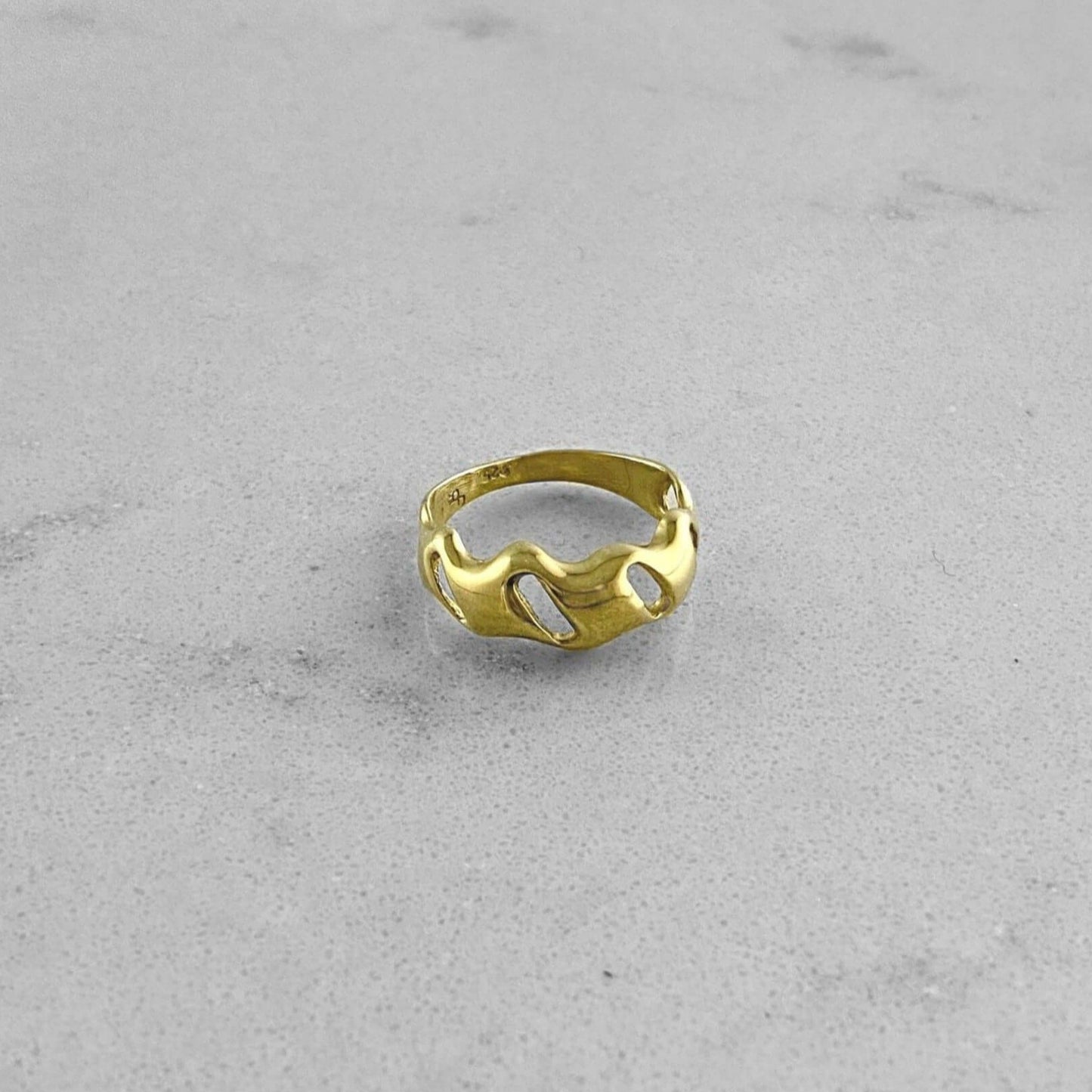 Product photo of a gold ring by Aur Studio