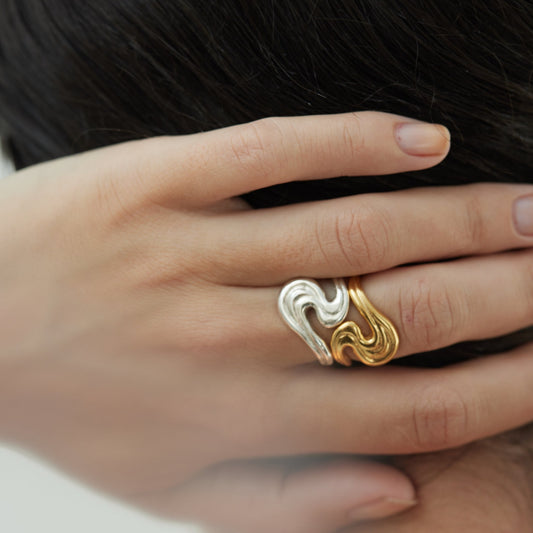 Hand with gold and silver rings