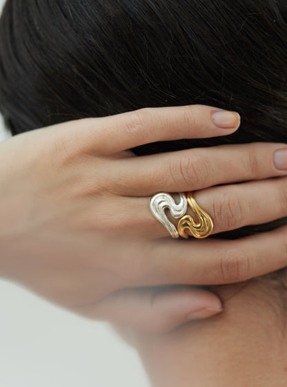 Models hand wearing rings