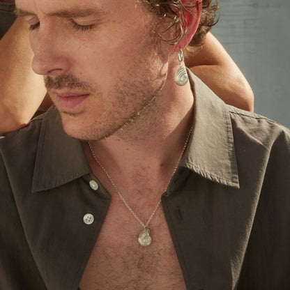 Male model wearing silver jewelry