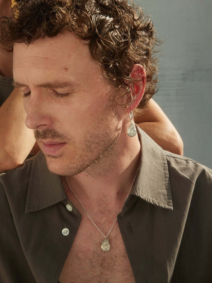 Model wearing silver jewelry