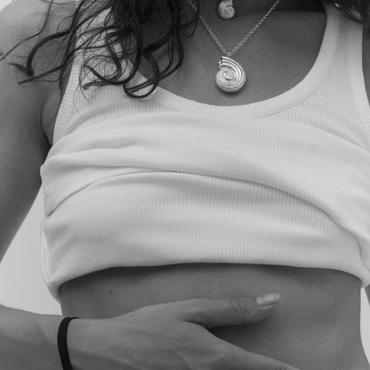 Black and white photo with female model wearing silver jewelry