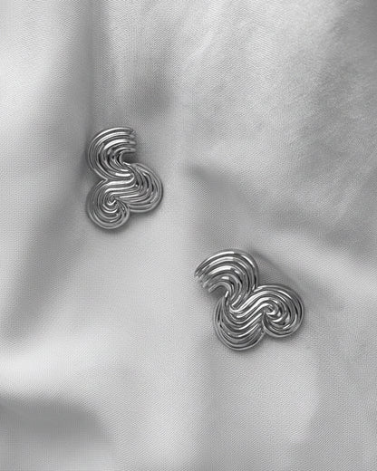 A pair of silver earrings