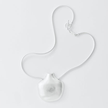 Silver necklace om white background
