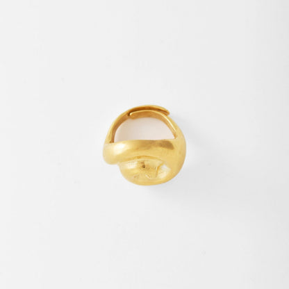 Gold spiral ring on a light gray background