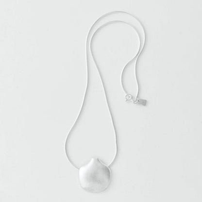 Silver necklace with a pendant on a light gray background