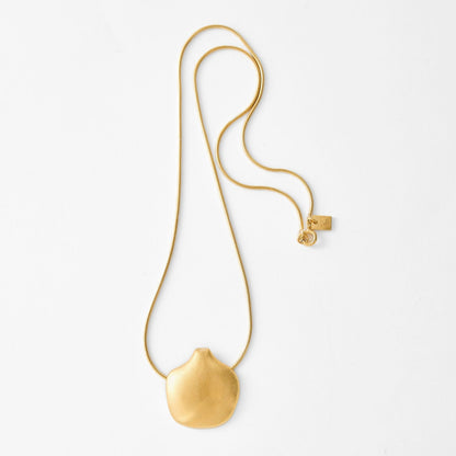 Gold necklace with a pendant on a white background