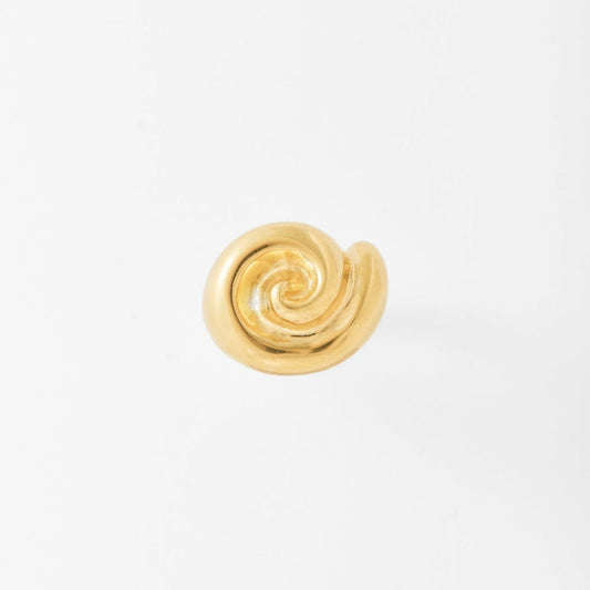 Gold spiral ring on a light gray background