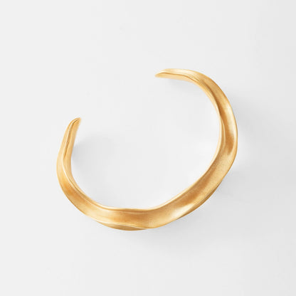 Gold bracelet on a white background