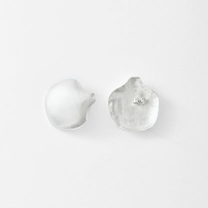 Pair of silver earrings on a light gray background