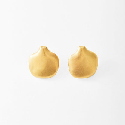 Gold earrings on a white background