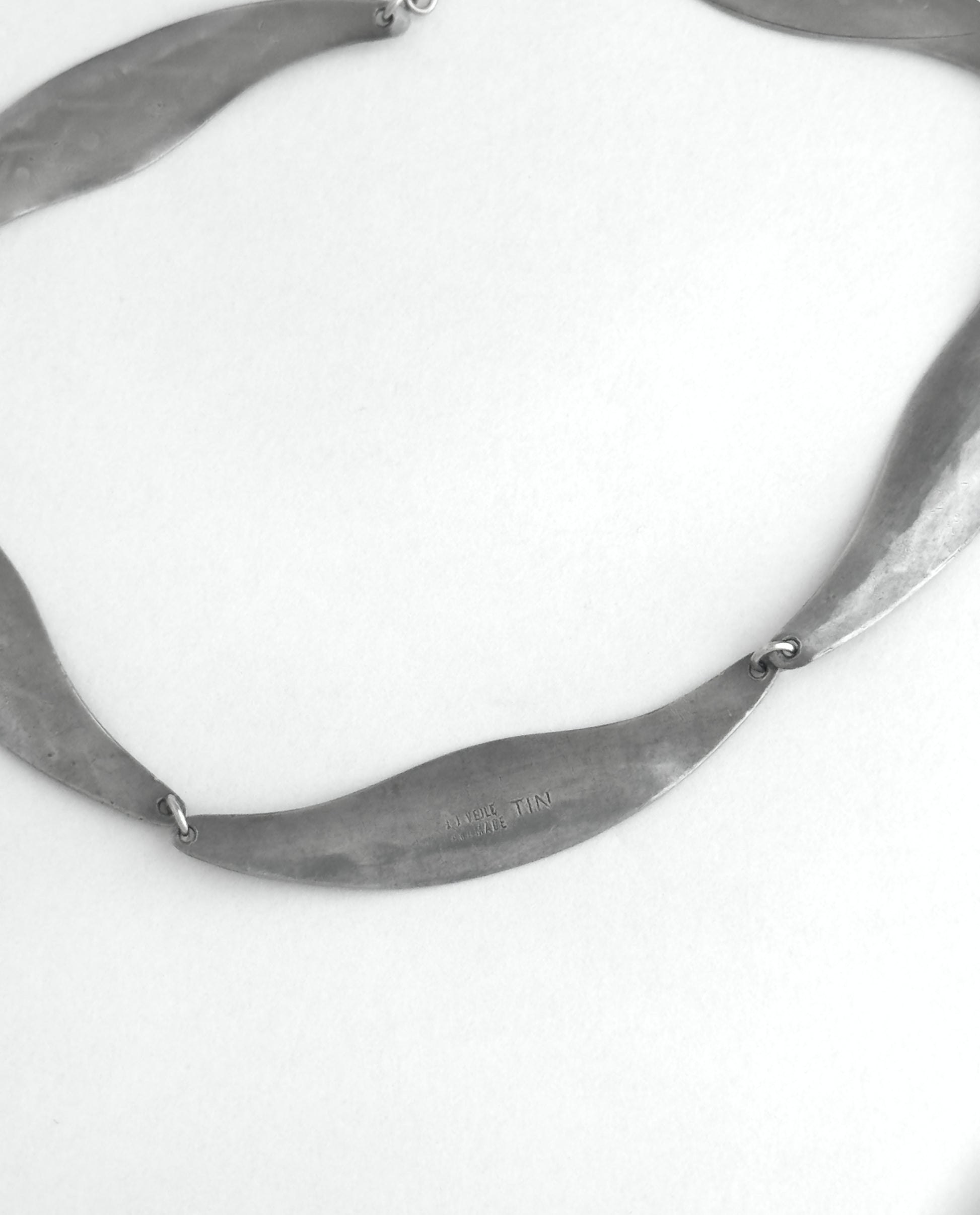 Pewter necklace on a white background