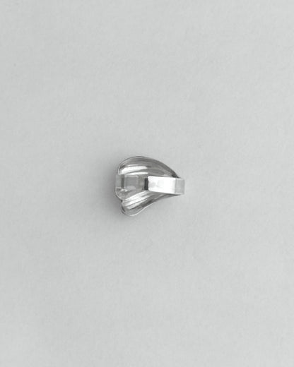 Silver ring on a light gray background