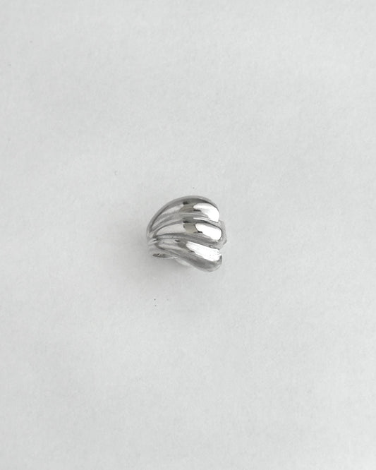 Silver ring on a light gray background