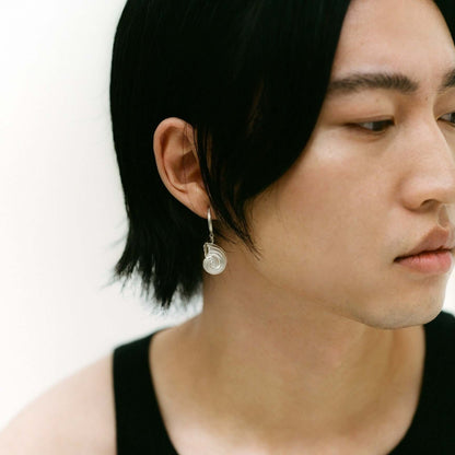 Model wearing silver earring