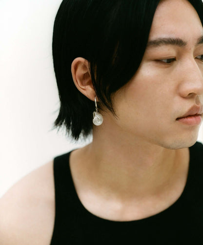 Model wearing silver earring