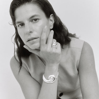 Model wearing silver jewelry