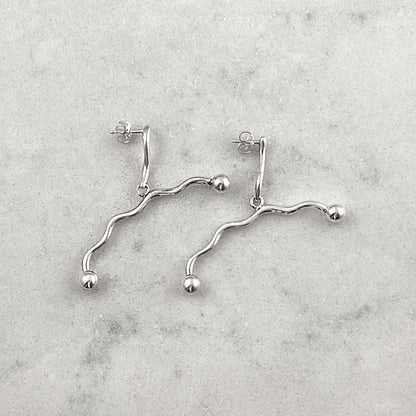 Product photo of silver earrings by Aur Studio