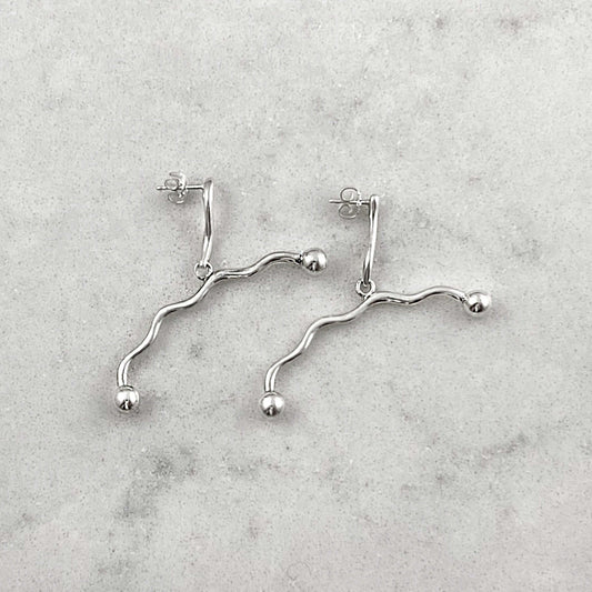 Product photo of silver earrings by Aur Studio