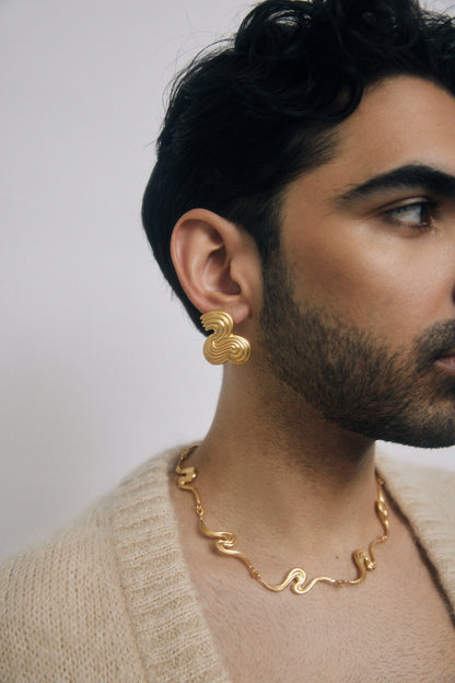 Man wearing gold jewelry