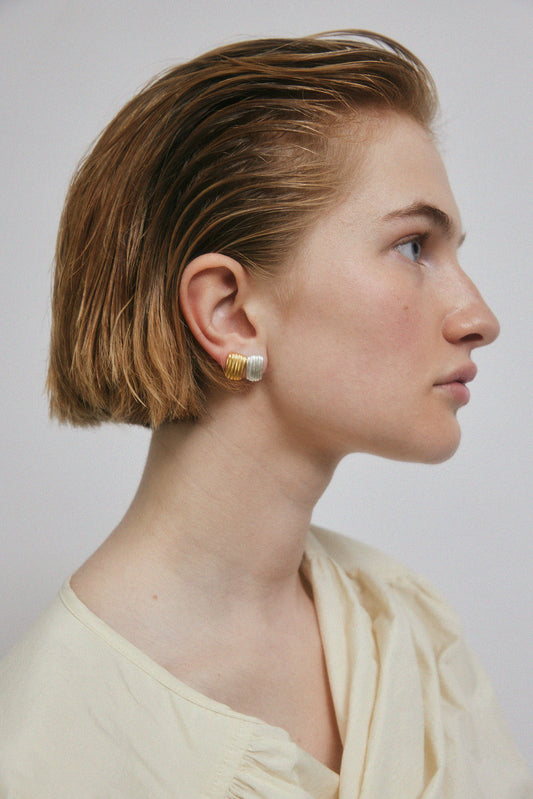 Profile of a woman wearing jewelry