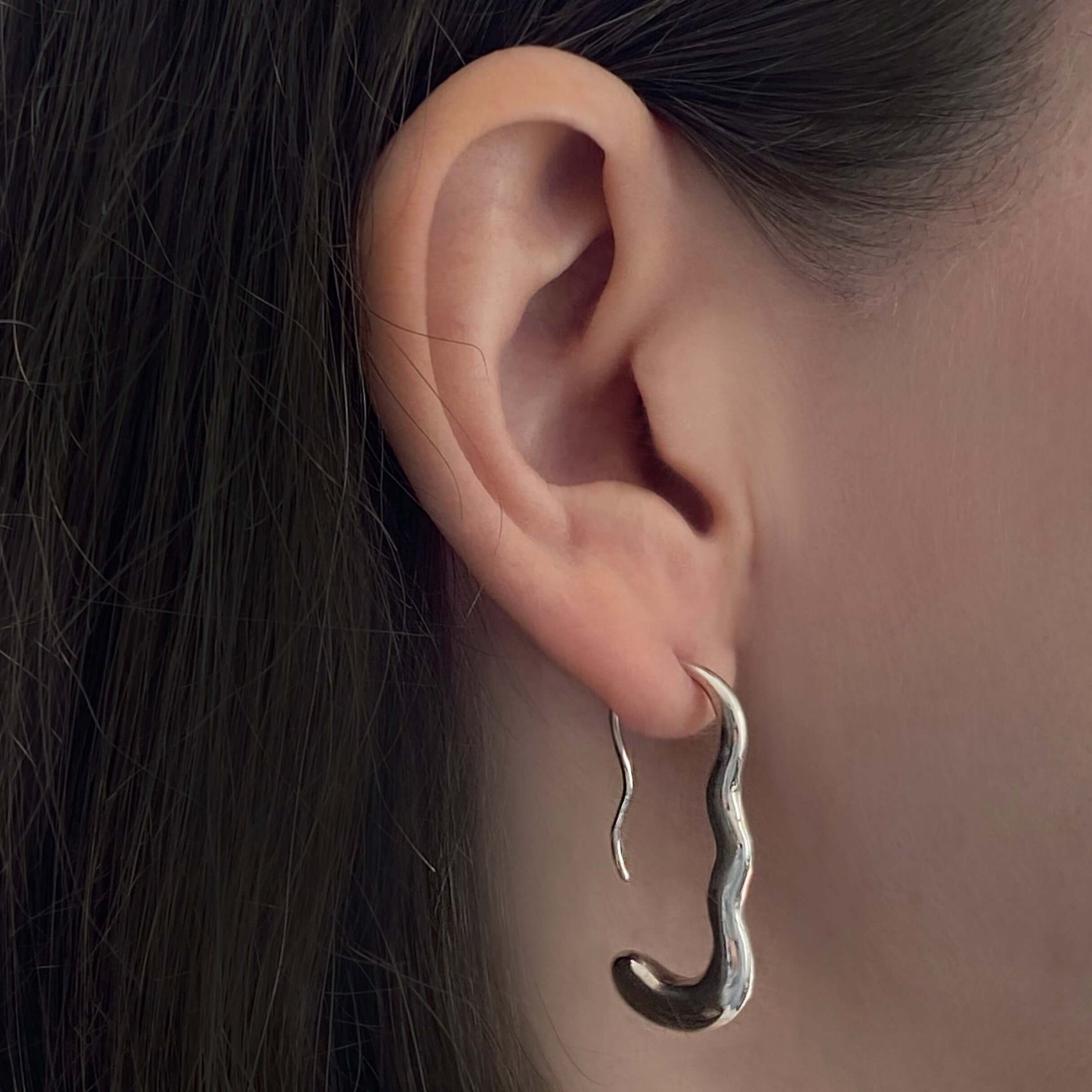 Ear with silver earring