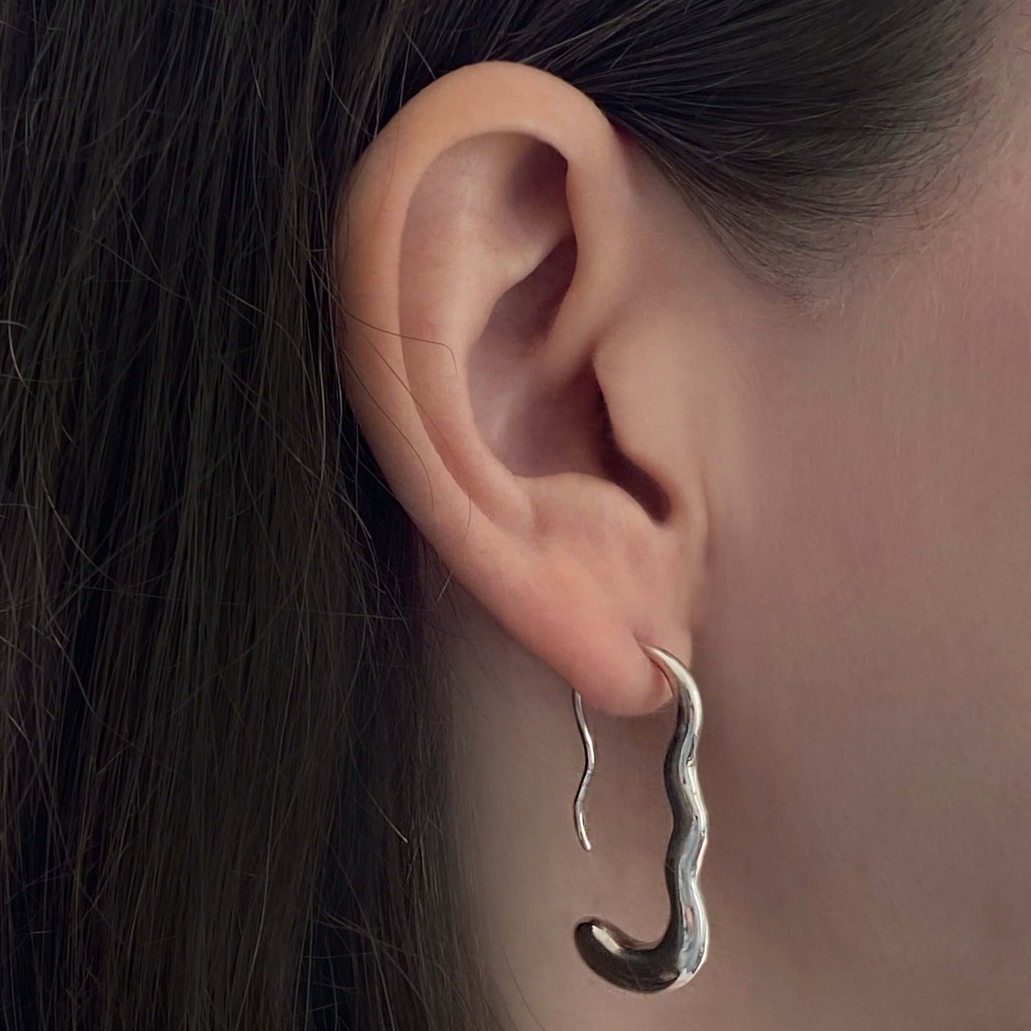 Ear with silver earring