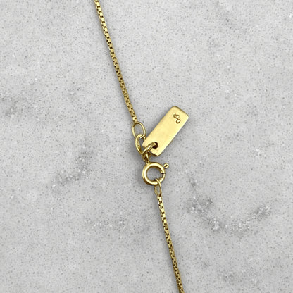 Close up on details of a gold necklace